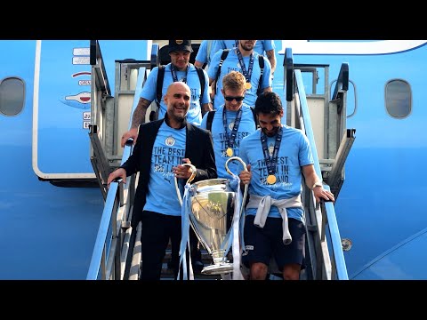 European Champions Manchester City arrive back in UK with Champions League trophy